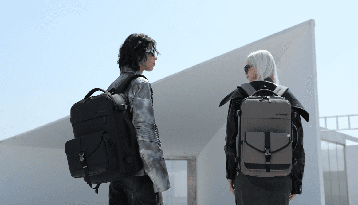 Two models showcasing Arctic Hunter backpacks